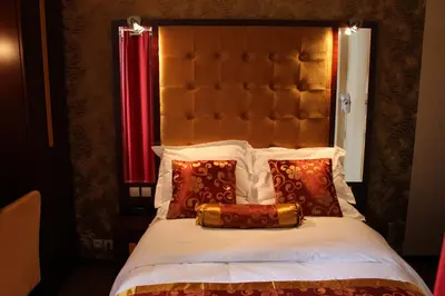 Un ou plusieurs lits dans un hébergement de l'établissement Hôtel des Buttes Chaumont