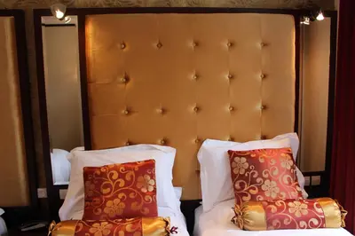 Un ou plusieurs lits dans un hébergement de l'établissement Hôtel des Buttes Chaumont