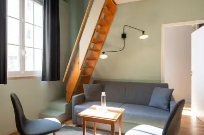 Coin salon dans l'établissement Hôtel Helzear Montparnasse by Esteem