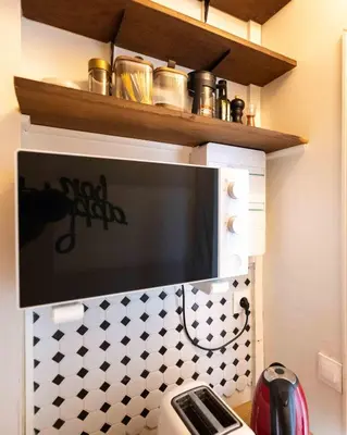 Cuisine ou kitchenette dans l'établissement Well located apartment in Paris
