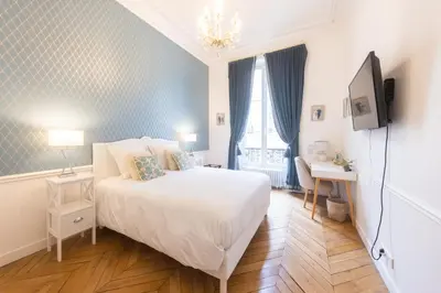 Un ou plusieurs lits dans un hébergement de l'établissement Maison de Lignières - Guest House - Paris quartier Champs-Elysées
