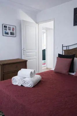Un ou plusieurs lits dans un hébergement de l'établissement Lion d'Or Paris Suites