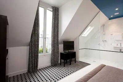 Un ou plusieurs lits dans un hébergement de l'établissement Hôtel Emile Le Marais