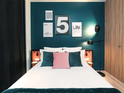Un ou plusieurs lits dans un hébergement de l'établissement Exclusive Loft in Le Marais with AC