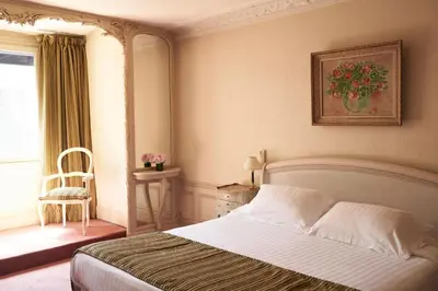 Un ou plusieurs lits dans un hébergement de l'établissement Hôtel Langlois