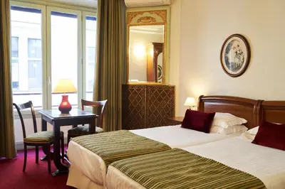 Un ou plusieurs lits dans un hébergement de l'établissement Hôtel Langlois