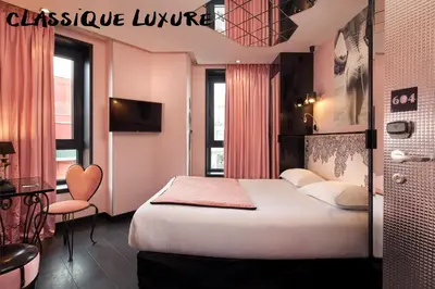 Un ou plusieurs lits dans un hébergement de l'établissement Hôtel Vice Versa