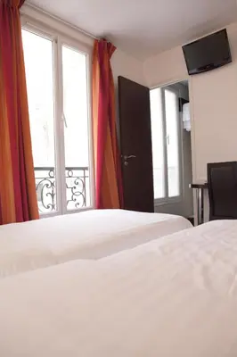 Un ou plusieurs lits dans un hébergement de l'établissement Royal Wagram