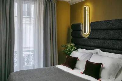 Un ou plusieurs lits dans un hébergement de l'établissement La Planque Hotel