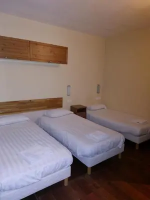 Un ou plusieurs lits dans un hébergement de l'établissement Résidence Molière Hôtel Paris Montrouge