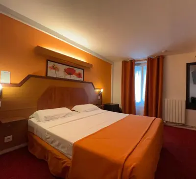 Un ou plusieurs lits dans un hébergement de l'établissement Le Nouvel Hôtel du Théâtre