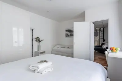 Un ou plusieurs lits dans un hébergement de l'établissement Loft Magenta Blue