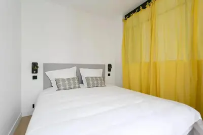 Un ou plusieurs lits dans un hébergement de l'établissement Appt central & cosy au cœur de Saint-Germain-des-Prés
