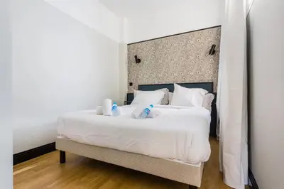 Un ou plusieurs lits dans un hébergement de l'établissement Appt calme central avec balcon - Opéra - Haussmann