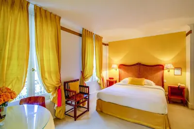 Un ou plusieurs lits dans un hébergement de l'établissement Villa Escudier Appart-hôtel