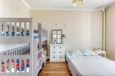 Un ou plusieurs lits dans un hébergement de l'établissement Appartement moderne à Saint-Denis - 65 m² avec balcon