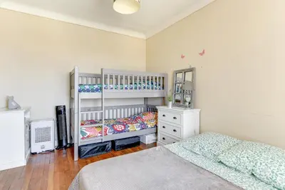 Un ou plusieurs lits dans un hébergement de l'établissement Appartement moderne à Saint-Denis - 65 m² avec balcon