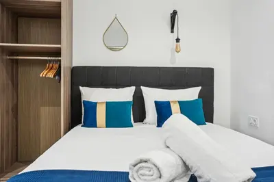 Un ou plusieurs lits dans un hébergement de l'établissement Tour Eiffel Apartment