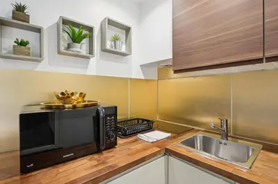 Cuisine ou kitchenette dans l'établissement Tour Eiffel Apartment