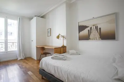 Un ou plusieurs lits dans un hébergement de l'établissement Appartement familial calme près de la Tour Eiffel