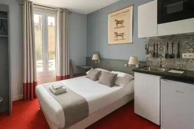 Un ou plusieurs lits dans un hébergement de l'établissement Hôtel du Parc Montsouris