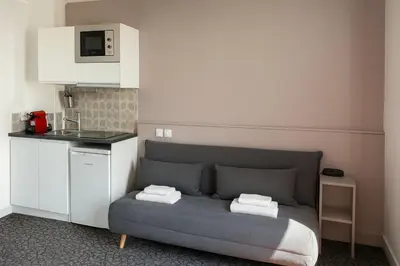Cuisine ou kitchenette dans l'établissement Hôtel du Parc Montsouris