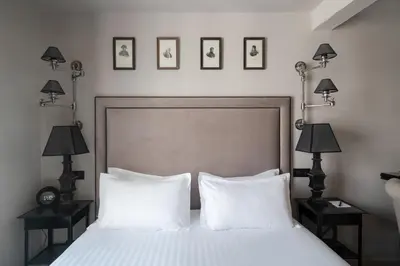 Un ou plusieurs lits dans un hébergement de l'établissement Hotel Saint-Louis en L'Isle - Notre-Dame