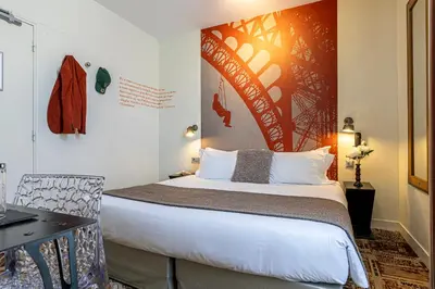 Un ou plusieurs lits dans un hébergement de l'établissement Hotel Alpha Paris Eiffel by Patrick Hayat