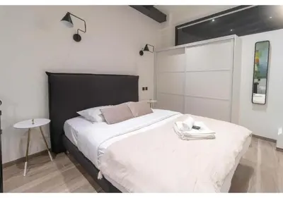 Un ou plusieurs lits dans un hébergement de l'établissement Apartment Saint Germain des Près by Studio prestige