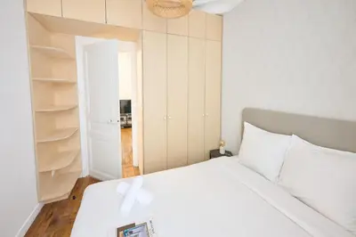 Un ou plusieurs lits dans un hébergement de l'établissement Très cosy 45m2, proche du parc des expositions