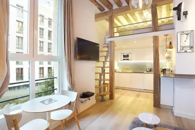 Cuisine ou kitchenette dans l'établissement Résidence Le Marais by Studio prestige
