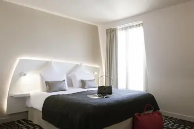 Un ou plusieurs lits dans un hébergement de l'établissement Mercure Paris Levallois