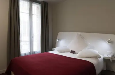 Un ou plusieurs lits dans un hébergement de l'établissement Mercure Paris Levallois