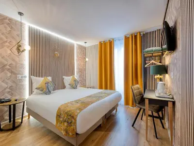 Un ou plusieurs lits dans un hébergement de l'établissement Hotel de Belfort