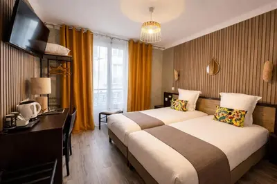 Un ou plusieurs lits dans un hébergement de l'établissement Hotel de Belfort