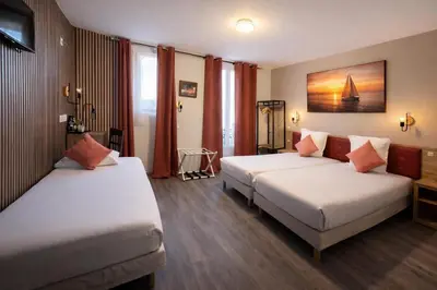 Un ou plusieurs lits dans un hébergement de l'établissement Hotel de Belfort