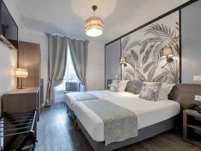 Un ou plusieurs lits dans un hébergement de l'établissement Hotel de Belfort