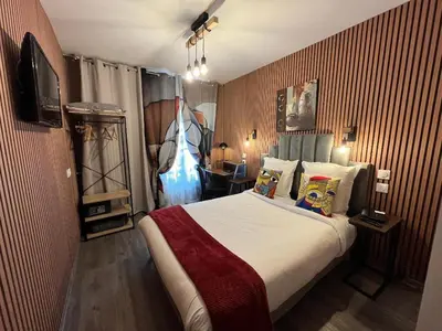 Un ou plusieurs lits dans un hébergement de l'établissement Hotel de Belfort