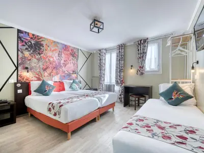 Un ou plusieurs lits dans un hébergement de l'établissement Hotel de Belfort