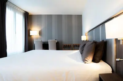 Un ou plusieurs lits dans un hébergement de l'établissement Hotel de Flore - Montmartre