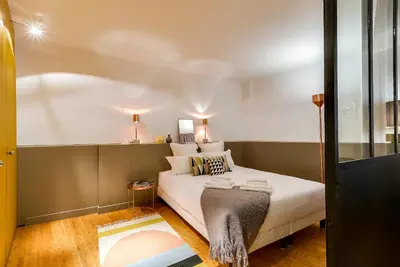 Un ou plusieurs lits dans un hébergement de l'établissement LE VAUGIRARD - 3bedrooms Apartment Premium