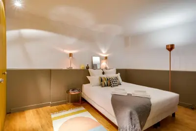 Un ou plusieurs lits dans un hébergement de l'établissement LE VAUGIRARD - 3bedrooms Apartment Premium
