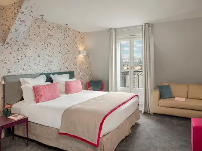 Un ou plusieurs lits dans un hébergement de l'établissement Hotel Le Mareuil