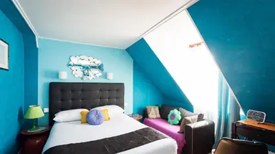 Un ou plusieurs lits dans un hébergement de l'établissement Hôtel Paris Voltaire