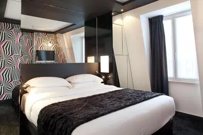 Un ou plusieurs lits dans un hébergement de l'établissement Georgette Hôtel & Restaurant