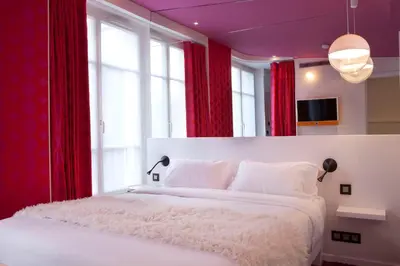 Un ou plusieurs lits dans un hébergement de l'établissement Georgette Hôtel & Restaurant