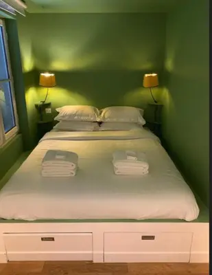 Un ou plusieurs lits dans un hébergement de l'établissement Midoon guest - DUPLEX D'ARCHITECT PARIS 10ème