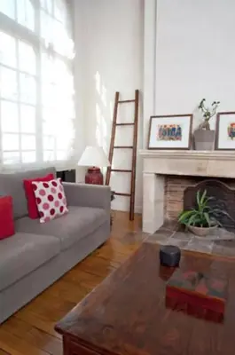Coin salon dans l'établissement Charming Cosy Triplex in Trendy Marais