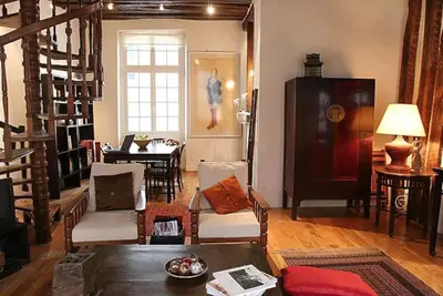 Coin salon dans l'établissement Charming Cosy Triplex in Trendy Marais