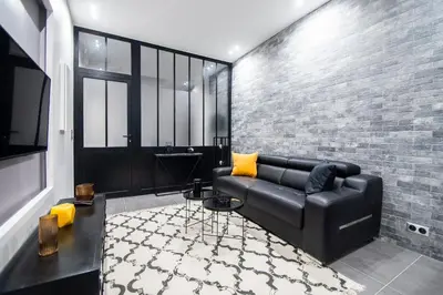 Coin salon dans l'établissement Dreamyflat - Loft Louvre